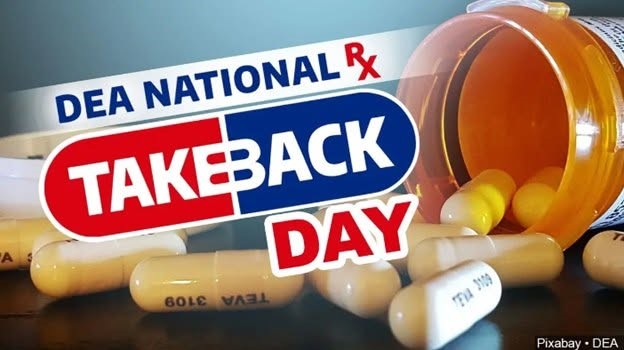 Graphic promoting DEA National Prescription Take Back Day, showing an overturned orange pill bottle with several capsules spilling out. The event logo appears prominently with the words “DEA National Rx Take Back Day.”