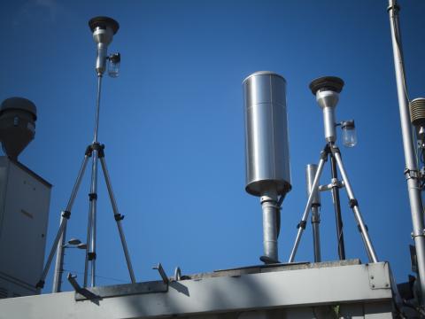 Air control station. Close-up of technical devices for determining the air quality on a rooftop against blue sky